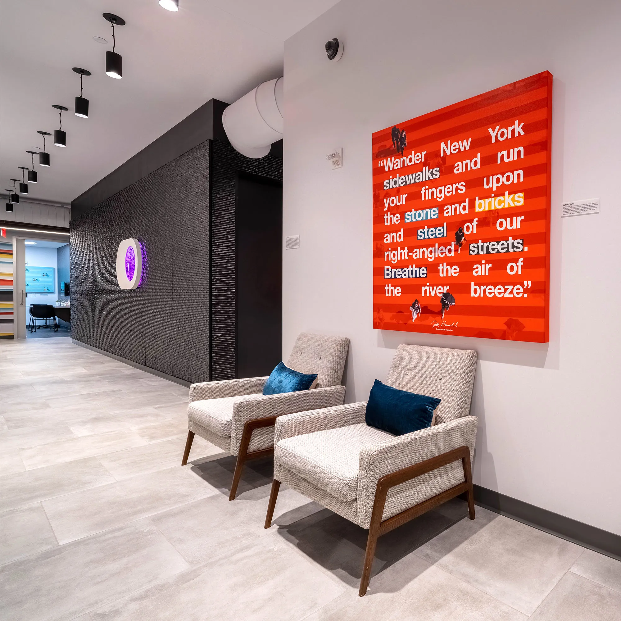 Crossover Health clinic waiting room with a red quote mural on the wall.