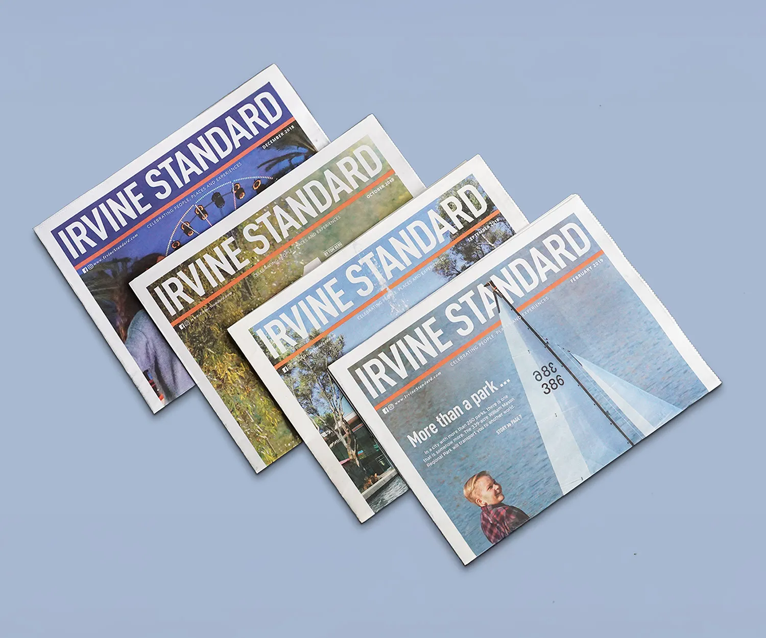 Four Irvine Standard issues fanned out on pale blue.