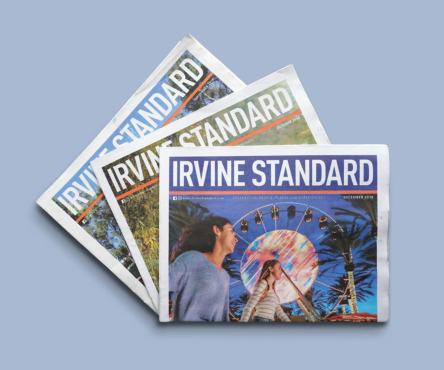 Irvine Standard front pages fanned out, ferris wheel cover on top.