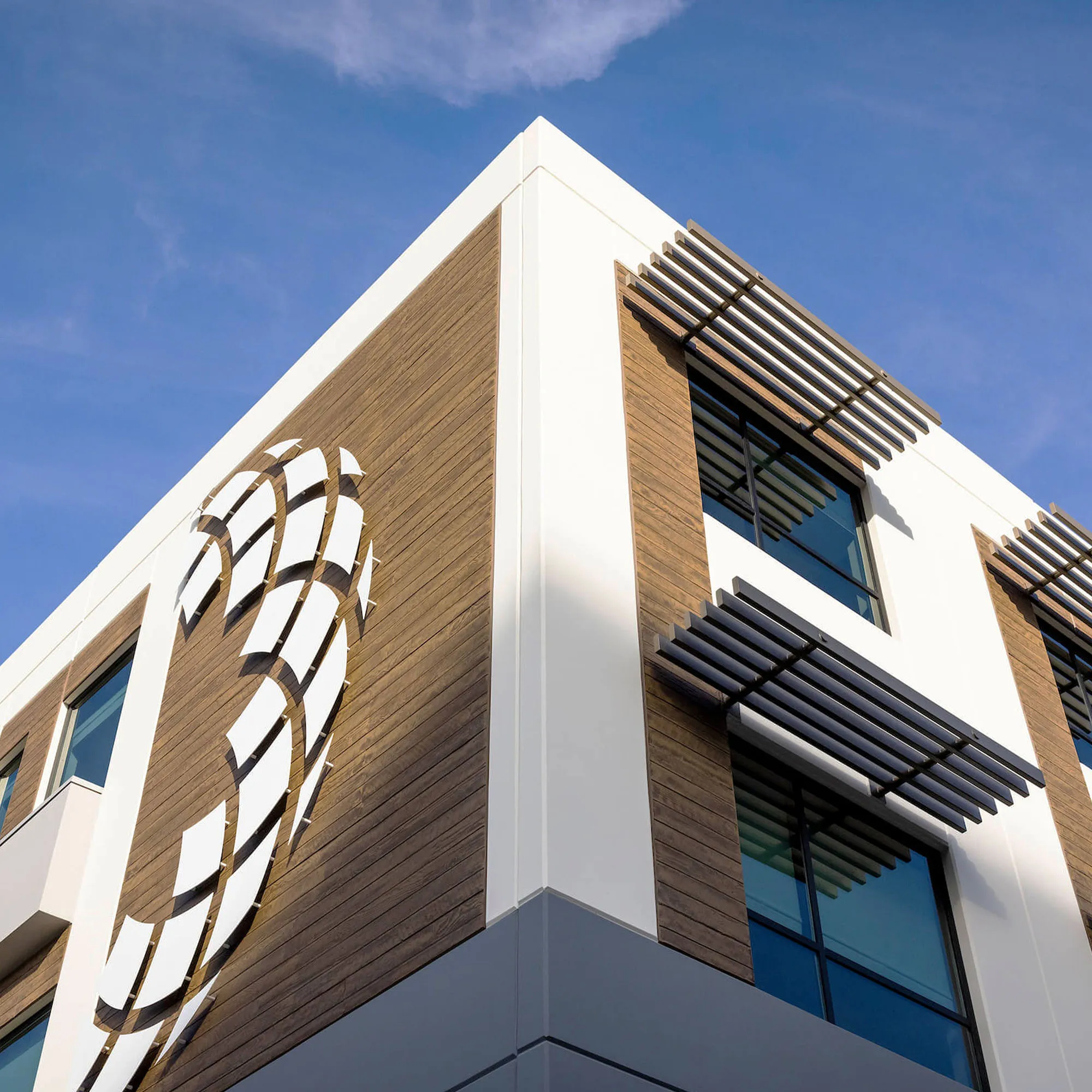 BeWell Orange County building exterior with the circular mosaic logo.