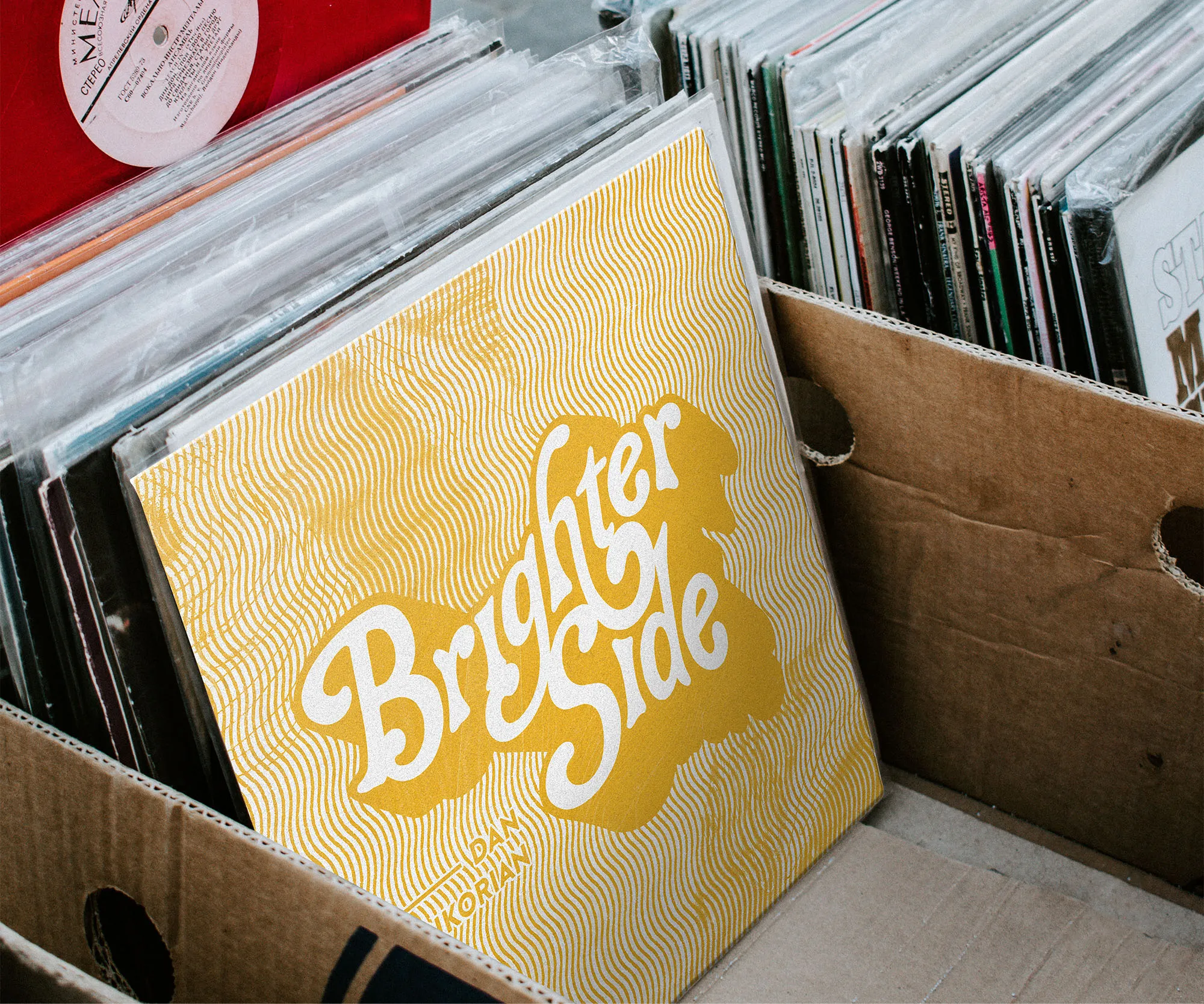 "Brighter Side" record filed in a crate of vinyl.