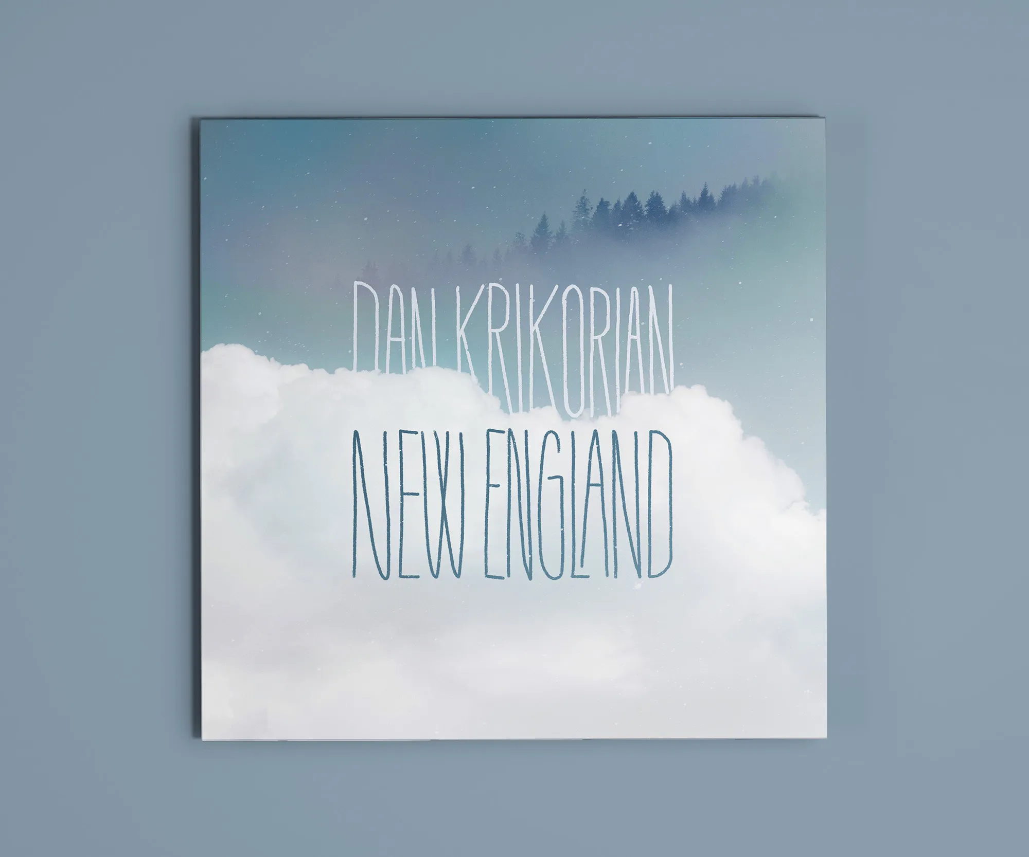 "New England" cover with lettering set into cloud photography.